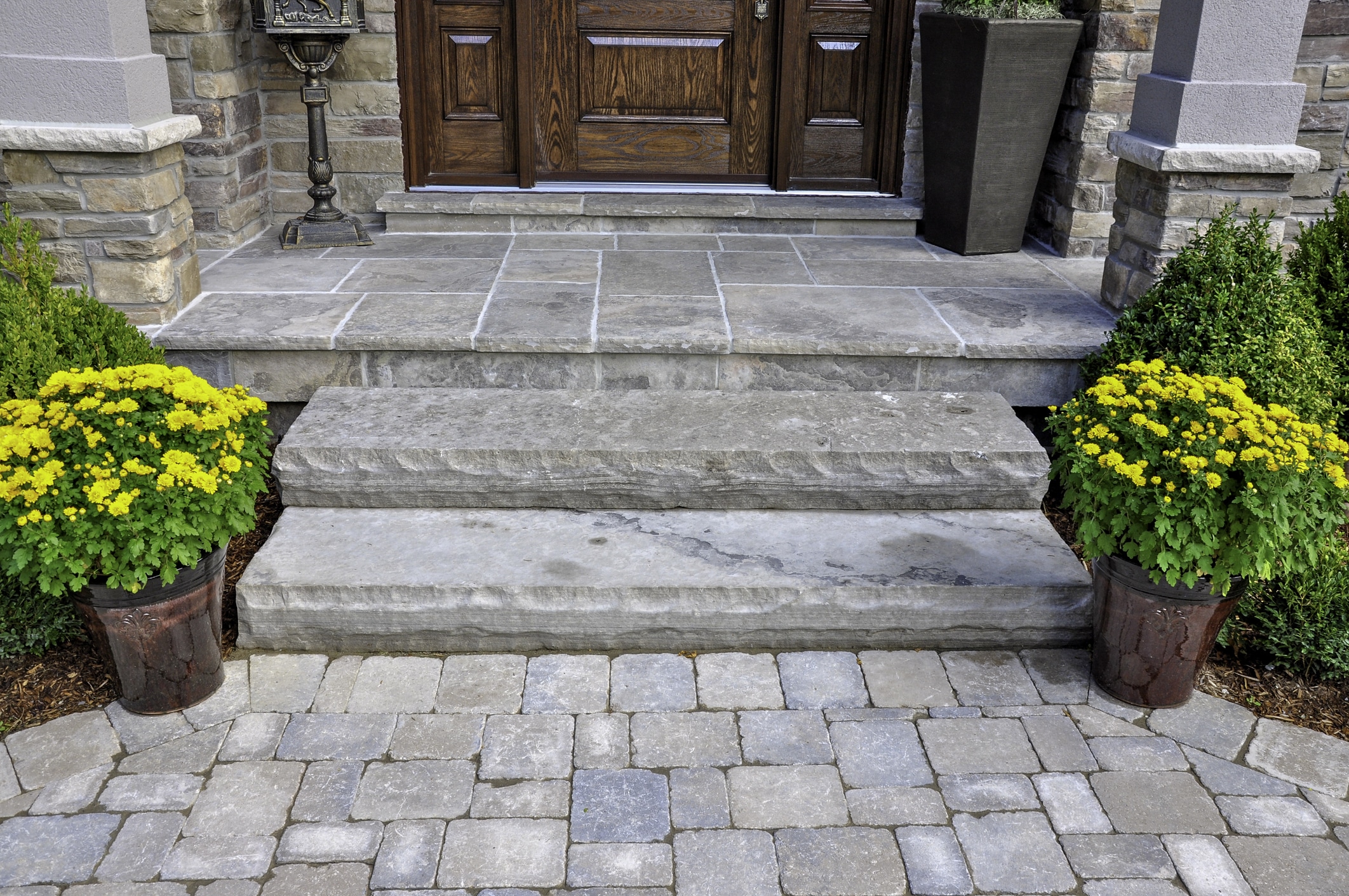High-quality stone steps installed in an outdoor walkway