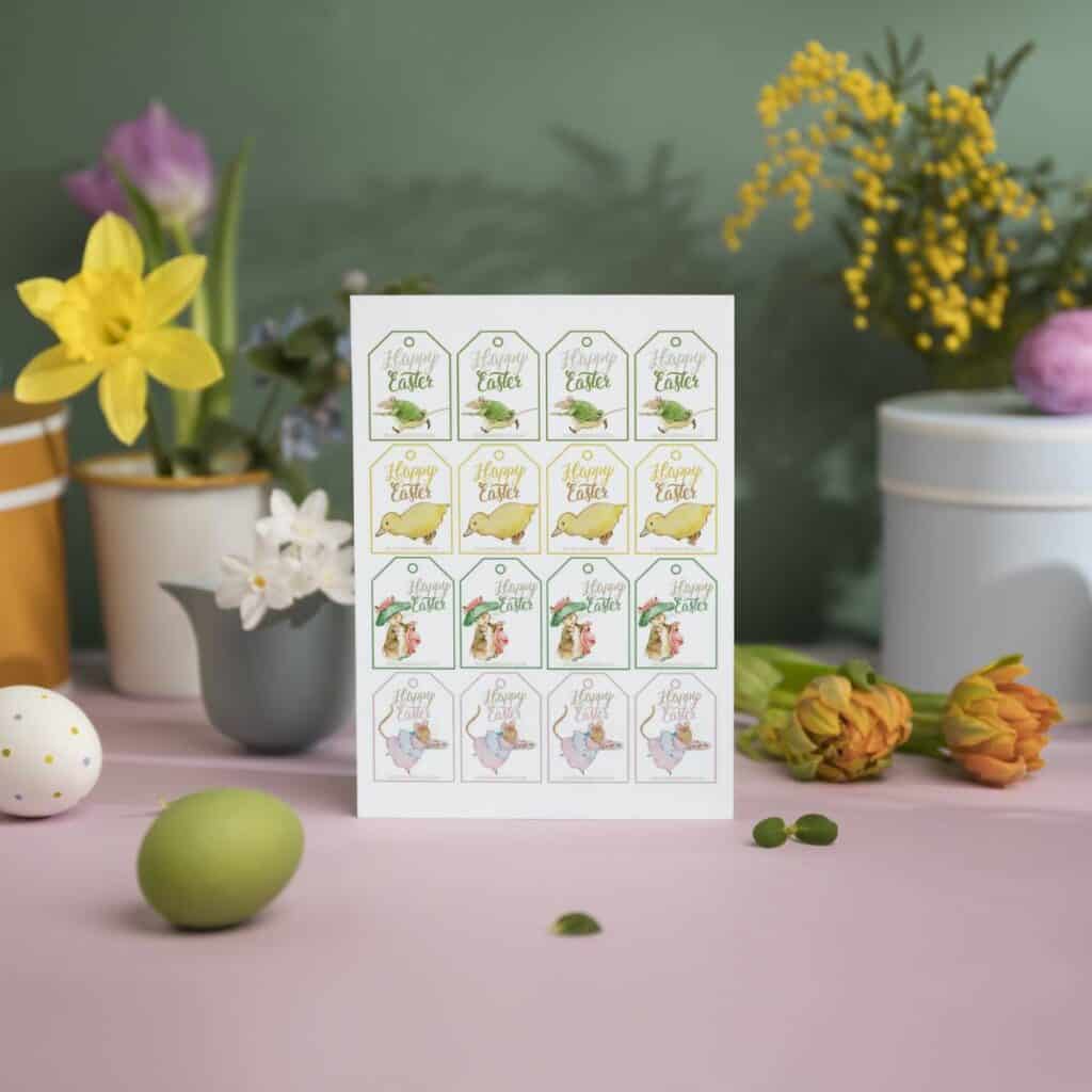 Easter Gift Tags Peter Rabbit and friends displayed with eggs, and spring flowers and plants in pots.