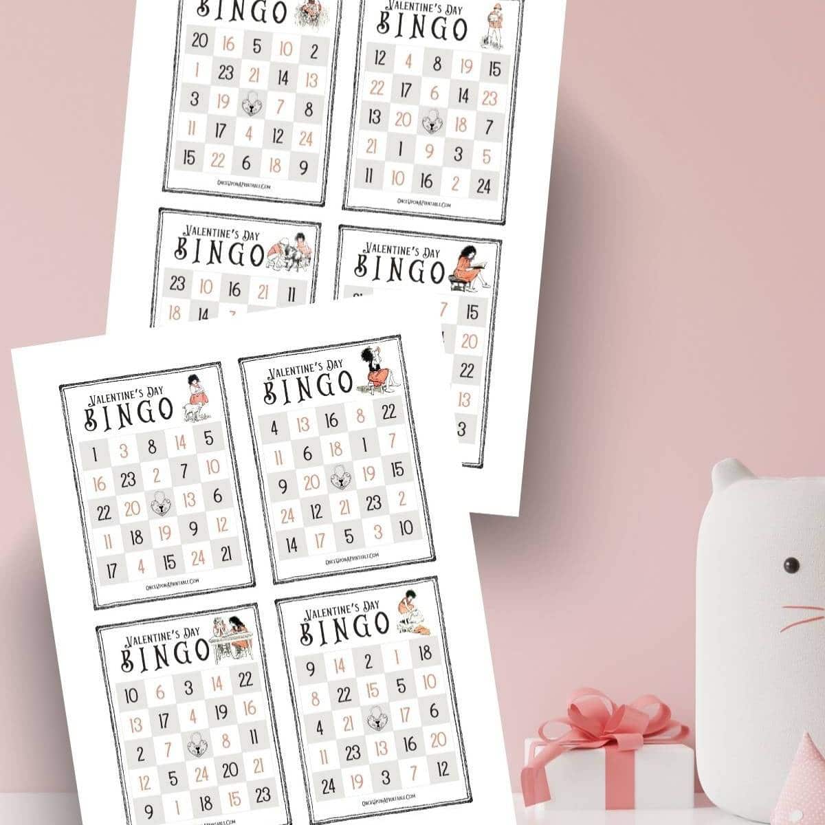 Brightly colored vintage illustrated bingo cards for Valentine's Day on a pink background.