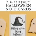 Witching you a Happy Halloween, Greeting card 3x5" on a black background with a witches hat on it.
