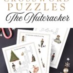 Nutcracker themed crossword puzzles with beautiful vibrant watercolor graphics printed and laying on a dark blue background with candy and cookies.