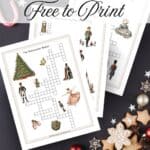 Nutcracker themed crossword puzzles with beautiful vibrant watercolor graphics printed and laying on a dark blue background with candy and cookies.