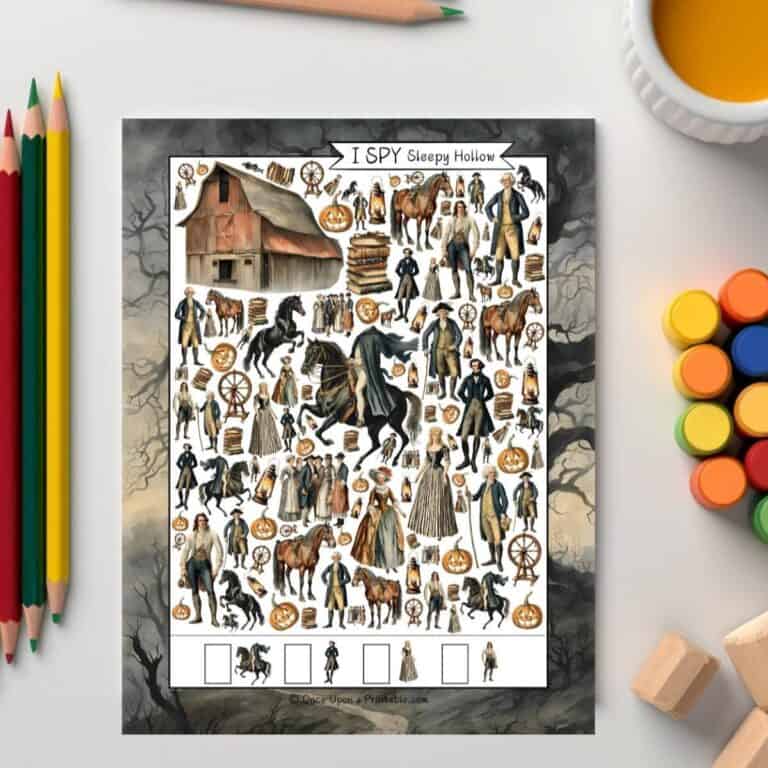 Easy version of the Sleepy Hollow I spy sitting on a white table next to some coloring pencils and paints.