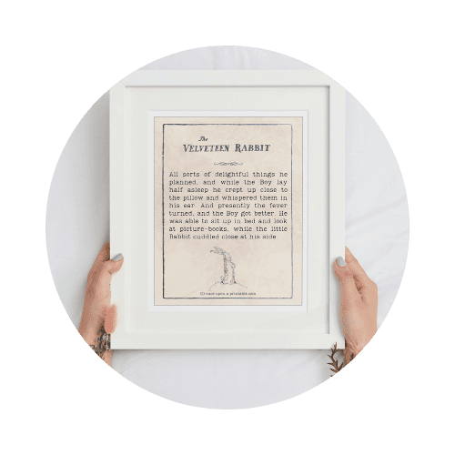 A woman's hands holding a framed quote from the Velveteen Rabbit.