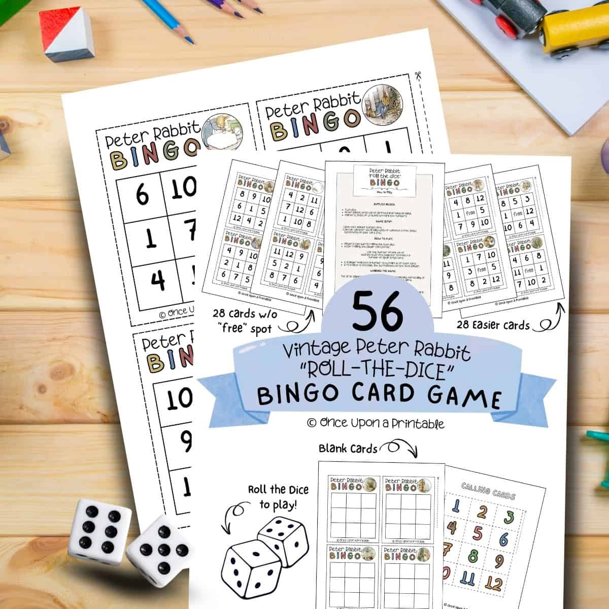 Peter Rabbit illustrated bingo cards laying on a wooden table with coloring pencils and crayons.
