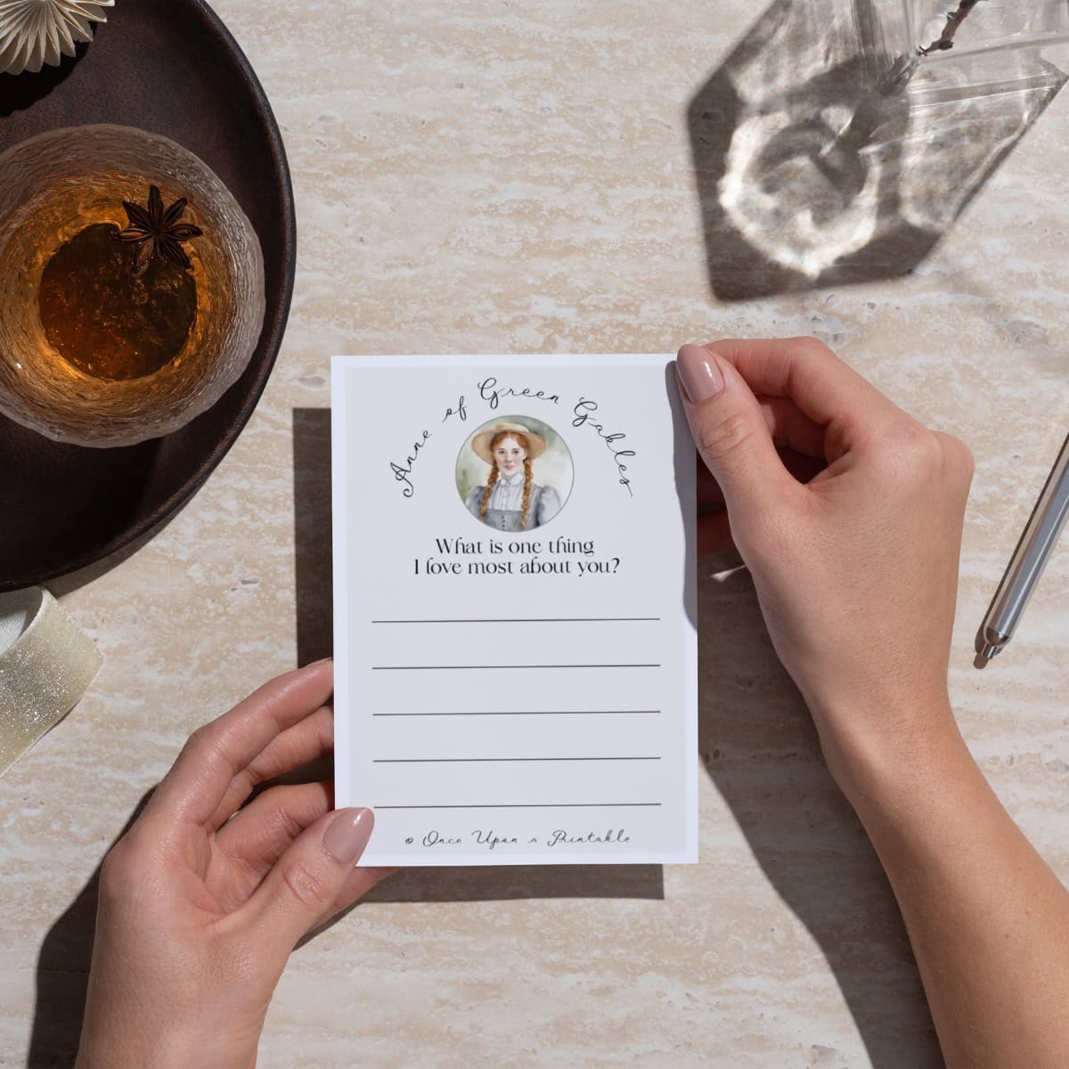 Anne of green gables friendship note held in a woman's hand.