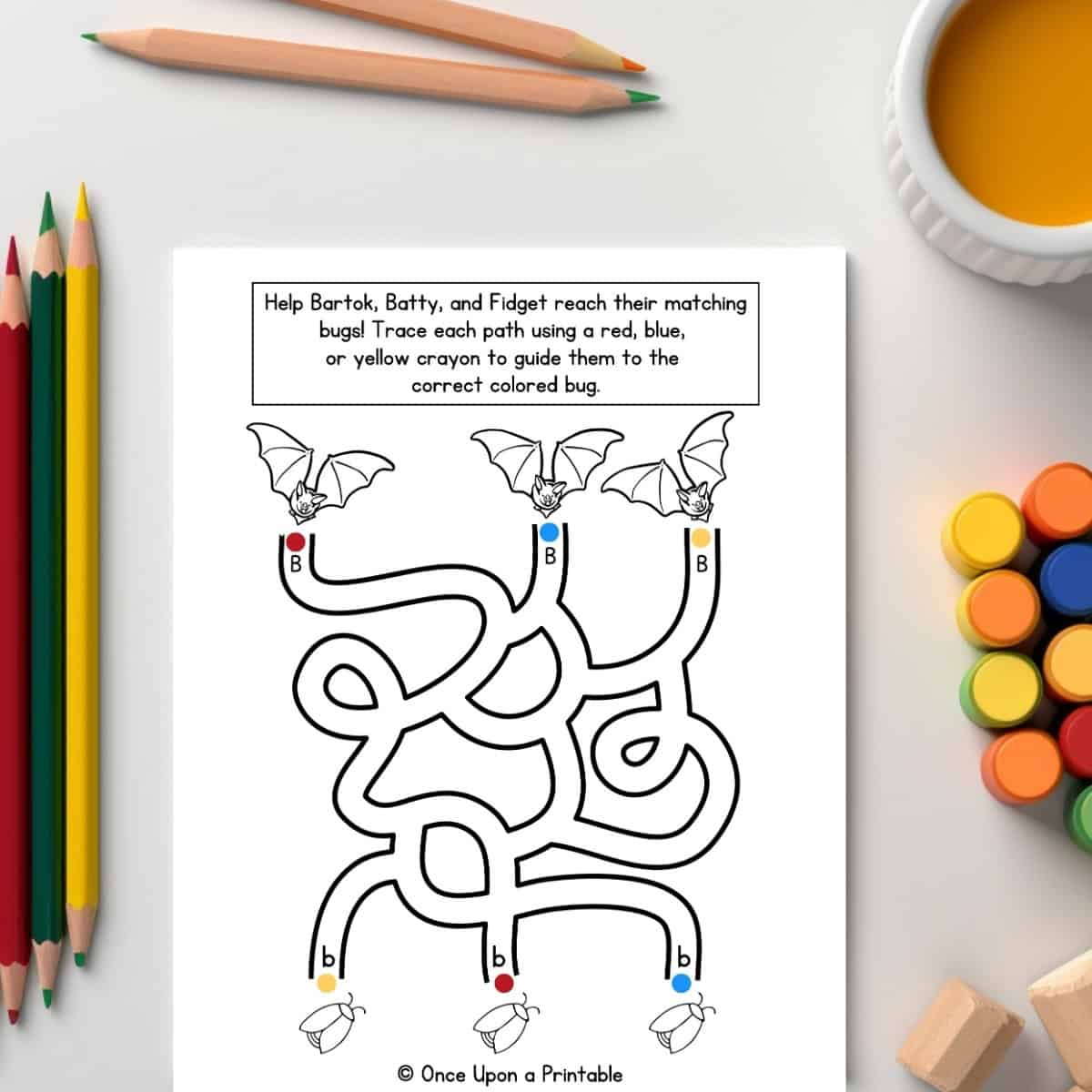 Letter B letter collection worksheet unit study laying on a table with coloring pencils and paint.