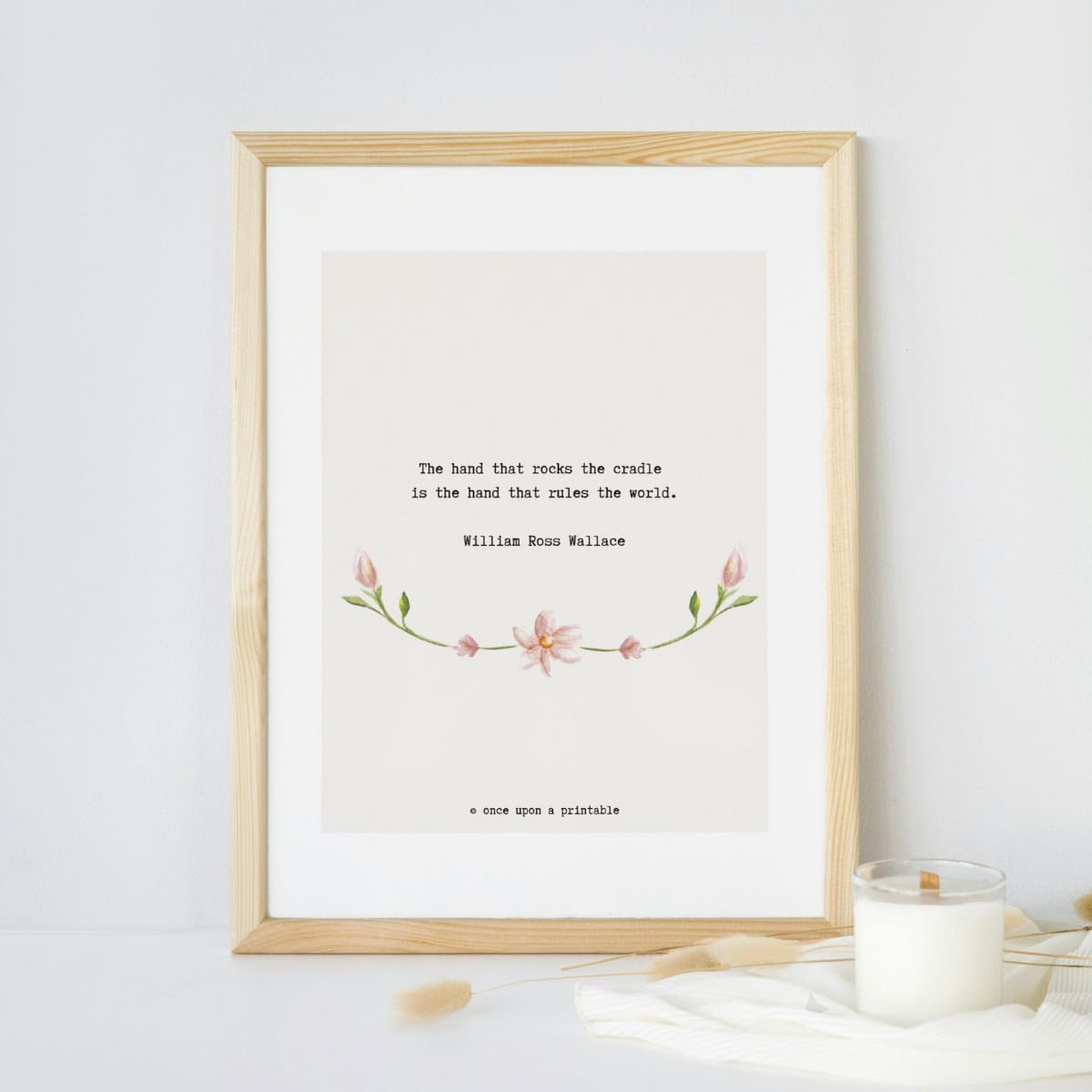 William Ross Wallace quote with watercolor flowers framed on display.