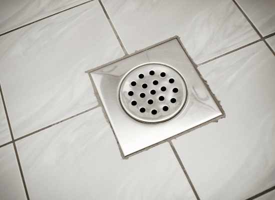 Close-up of a clean floor drain after professional maintenance