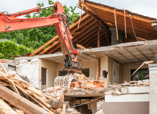 Controlled demolition of a multi-story structure in progress