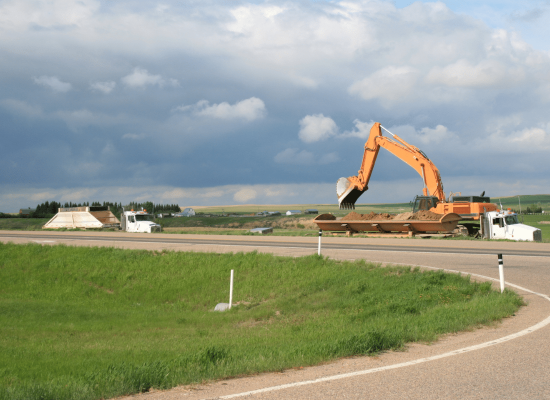 Excavation team preparing site for DOT highway expansion