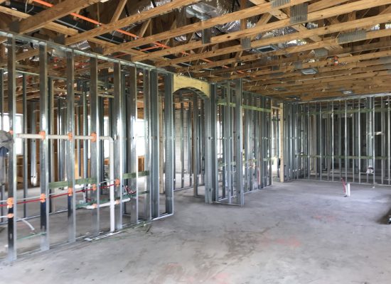Construction crew working on commercial project foundation