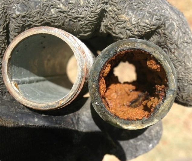 A pipe blocked with rust shows a plumbing problem that Prodigy Sewer and Drain can fix fast.