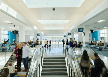 A photograph of travelers in San Bernardino International Airport's busy passenger concourse