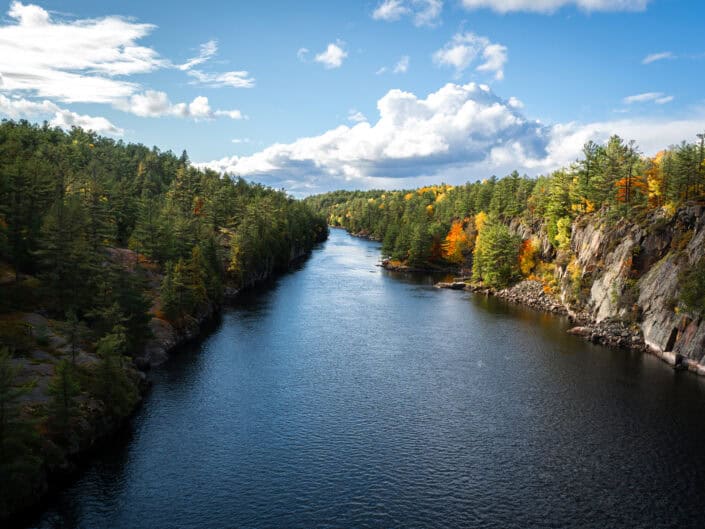 A view of the French River from the Suspension bridge at the beginning of Autumn