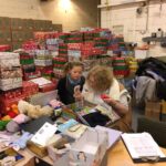 pupils creating xmas shoe box parcels