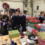 pupils creating xmas shoe box parcels