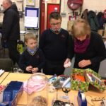 pupils creating xmas shoe box parcels