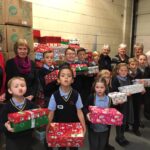pupils creating xmas shoe box parcels