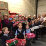 pupils creating xmas shoe box parcels
