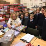 pupils creating xmas shoe box parcels