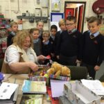 pupils creating xmas shoe box parcels