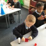 Pupils creating poppies
