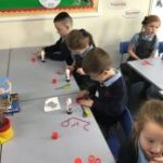 Pupils creating poppies