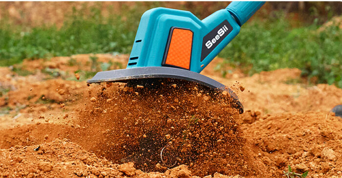 Electric garden tiller cultivates soil effectively.