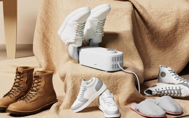 Footwear dryer with various shoes surrounding it.