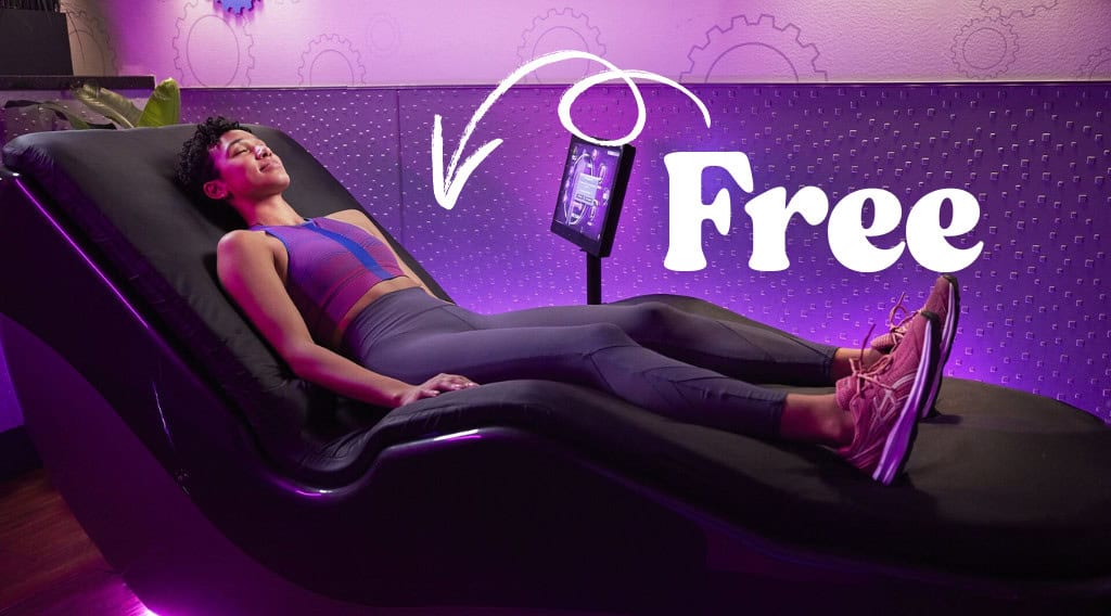 Person relaxing on massage chair, free session offered.