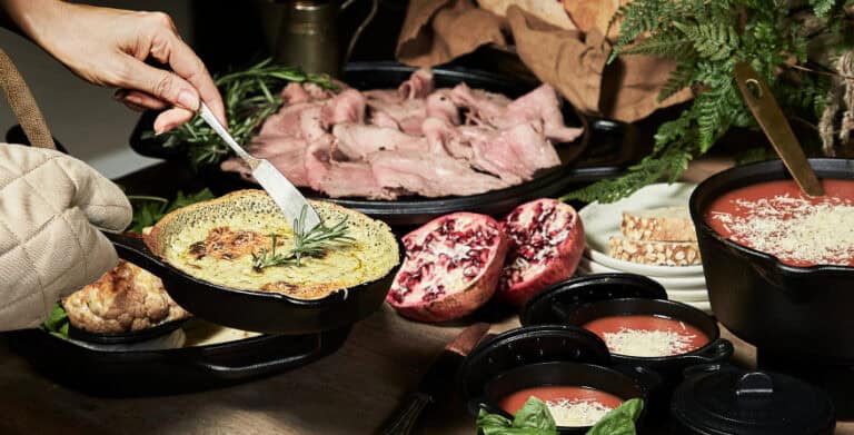 Gourmet brunch spread with savory dishes and fresh produce.