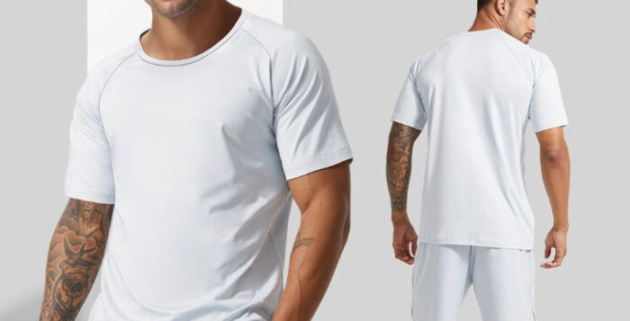 Model wearing white athletic shirt front and back view.