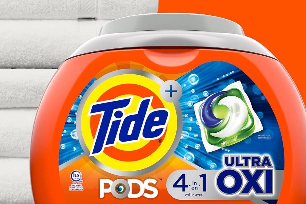 Tide Ultra Oxi Pods with folded white towels.
