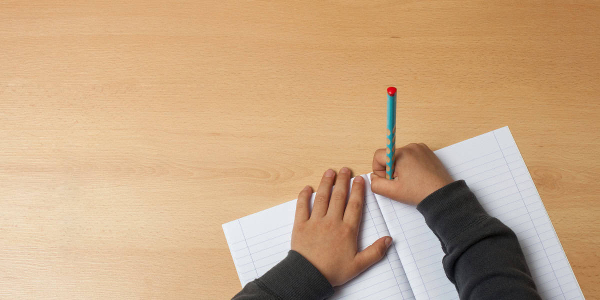 kids writing on table