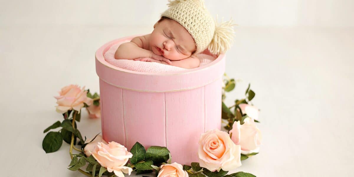 newborn photograph in container
