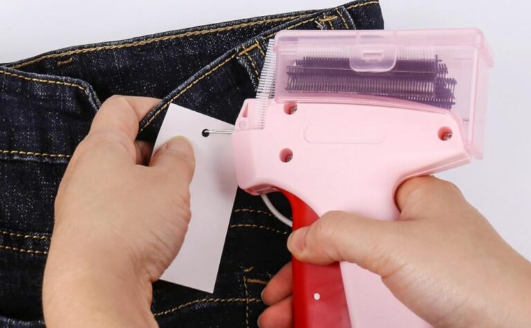 Using tagging gun on denim fabric.