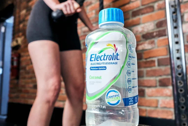 Electrolit coconut flavor electrolyte drink in gym setting