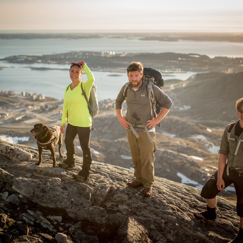 Hikers taking a break while ascending Ukkusissaq - Store Malene in Nuuk in Greenland. Photo - Mads Pihl, Visit Greenland