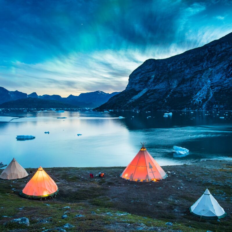 Colorful tents in a camp to shore- Nomad Greenland photo archive