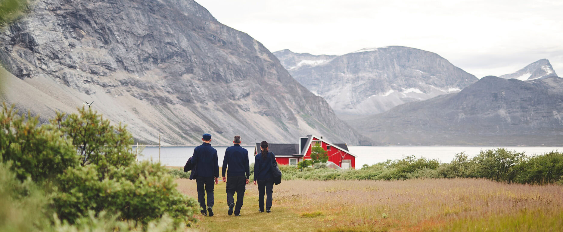 Three sailors at the coast in Qooqqut. Photo - Peter Lindstrom , Visit Greenland