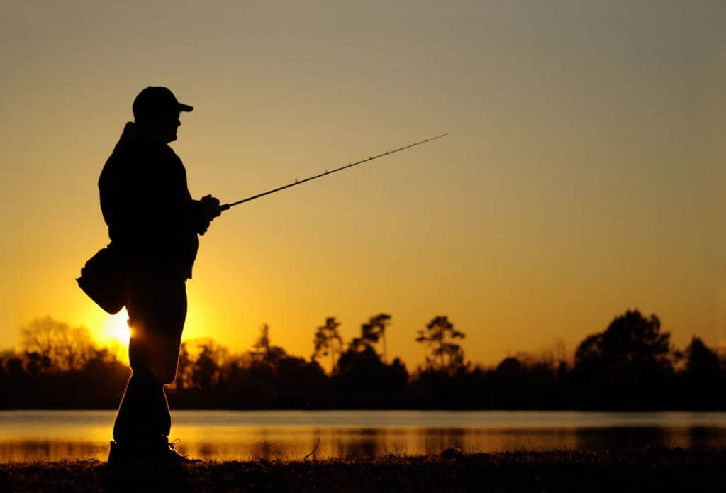 fishing man fishing on the shore