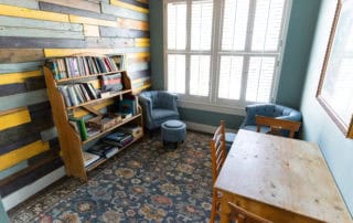 A small meeting space and bookshelf