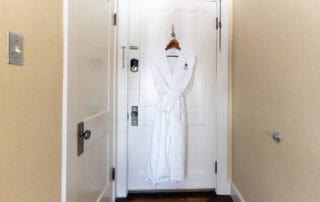 A robe hanging on a door
