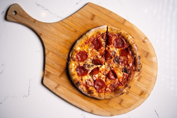Pepperoni pizza - Pepperoni, tomato sauce, mozzarella, and provolone from Mama DeVechio's Pizzeria
