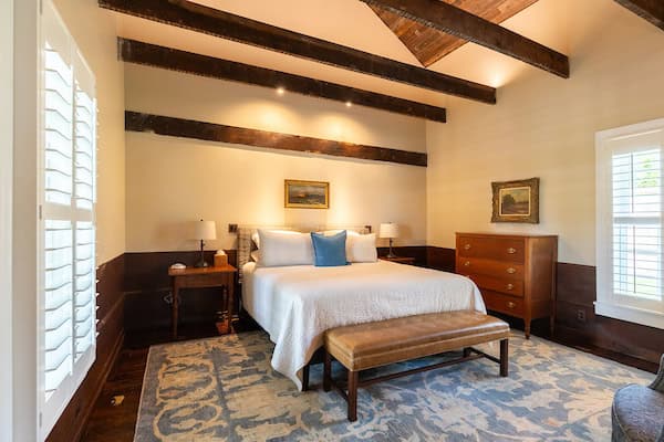 The master bedroom located on the first floor has a king bed and full bath with a steam shower in the Hart House