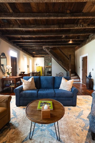 Living space on the first floor of the Hart House with both a wood-burning stove and gas fireplace.