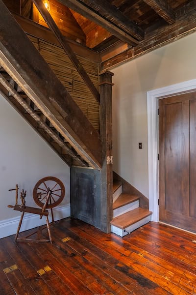 Restored staircase leading upstairs to loft area and second bedroom at the Hart House