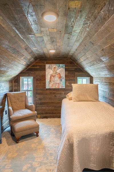 Upstairs of the Hart House, is a small log area with a second bedroom with a twin bed.