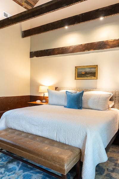 The master bedroom located on the first floor of the Hart House has a king bed and full bath with a steam shower.